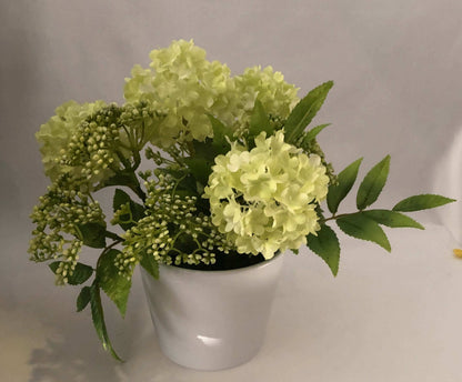 Gorgeous artificial green snowball hydrangea with lovely textural sorbus in a small round white vase. Perfectly for bathroom or side-table to add a little colour to a dull area.  Size: H25xW28CM