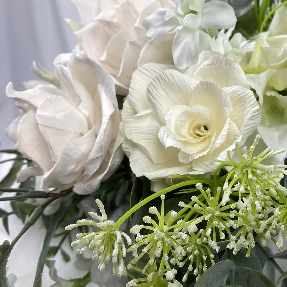 A gorgeous posy of white and Ivory roses and Chrysanthemums mixed with green foliage.  Size:  31Hx36Diameter  For this bouquet in a different colour, please contact us for a custom quote.