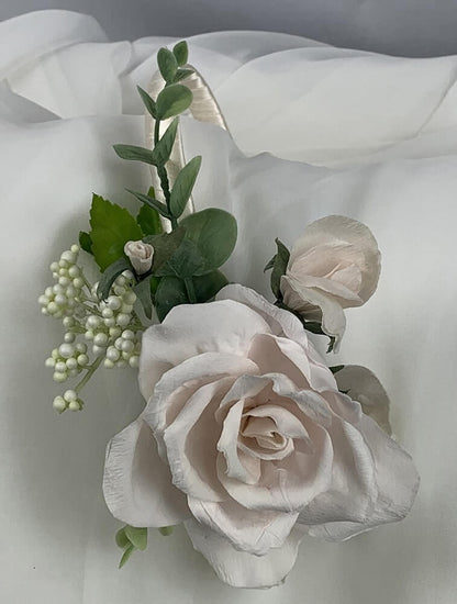Beautiful satin, double bound, headband with a stunning blush hand-crafted paper rose. This accessory can be colour matched to your theme and can be worn by both bride and bridesmaids. Artificial flowers. Atelier Blooms Auckland