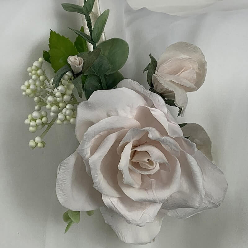 Beautiful satin, double bound, headband with a stunning blush hand-crafted paper rose. This accessory can be colour matched to your theme and can be worn by both bride and bridesmaids. Artificial flowers. Atelier Blooms Auckland