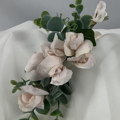 Understated satin, double bound, elegant blush headband featuring handcrafted paper sweet peas and artificial eucalyptus. This accessory can be colour matched to your theme and can be worn by both bride and bridesmaids. Atelier Blooms Auckland