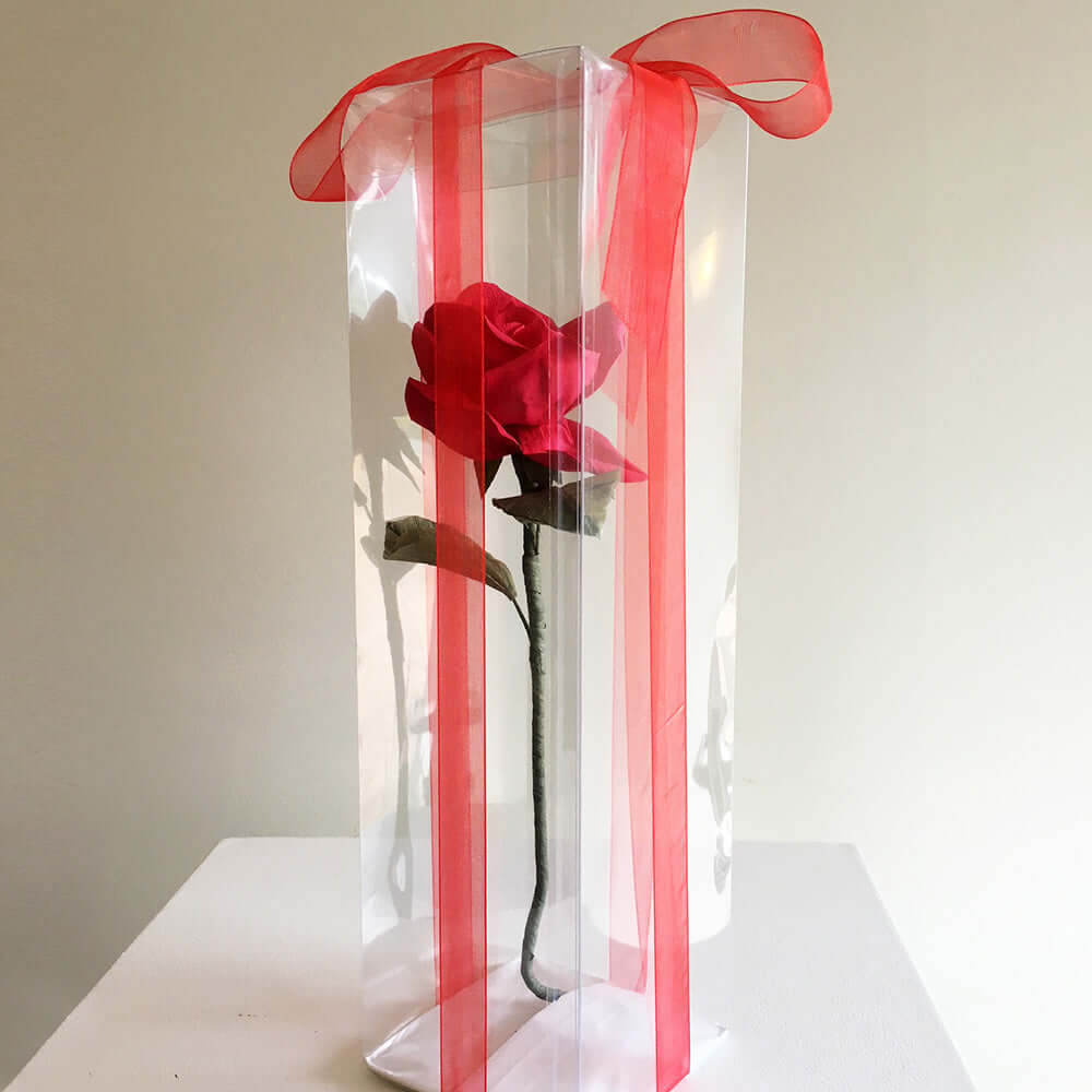 Beautiful long stemmed hand-crafted paper rose in clear box with a a lovely ribbon. A little something different! Give the gift that never dies. Size: 20cm
