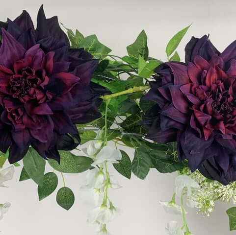 This beautiful garland is a mix of rich, deep aubergine madrid dahlia's, wisteria, spider chrysanthemums and Queen Anne lace. Can be hung anywhere or straightened out to place on your wedding table or fireplace mantle for a backdrop for your wedding photo
