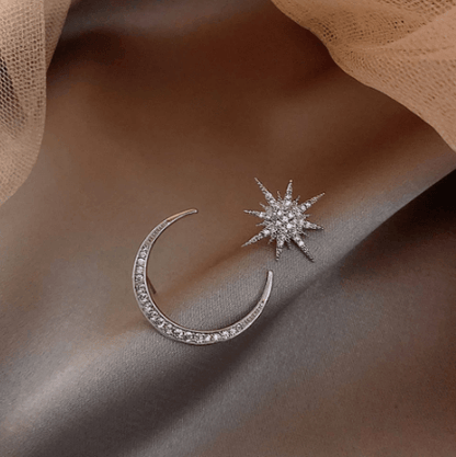Our new star and moon earrings are perfect for anyone who loves celestial-themed jewellery. They are made of high-quality metal. The design features a delicate moon and star motif, making them perfect for adding a touch of sparkle and charm to any outfit.