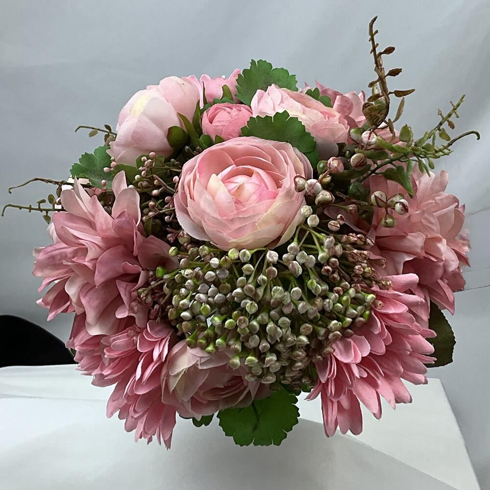 Gorgeous posy of dahlia's, gerbera's and ranunculus with erica berry.  Size: H30xDiam25cm  For this bouquet in a different colour, please contact us for a custom quote.