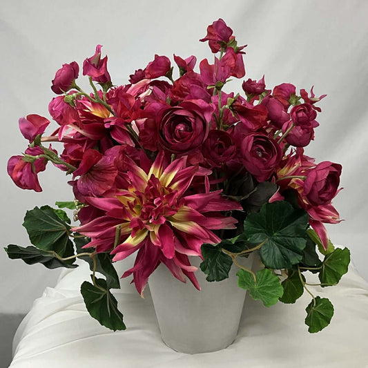 AArtificial Flower Arrangement. Beautiful and vibrant Ranunculus, Sweet pea, and Cactus Dahlia in stunning fuchsia, mixed with erica berry and geranium leaves. Add some beautiful fuchsia colour to your living area or hall table. Size: H37xW35cm.