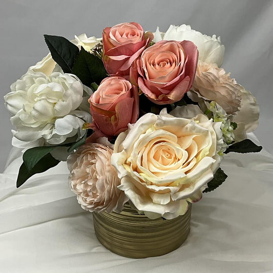 Romantic artificial flower arrangement of roses and peonies has a beautiful mix of blush, ivory and pink roses and peonies in a gold ceramic vase. Each petal is artfully arranged with perfection to make a stunning artificial floral arrangement. Atelier Bl
