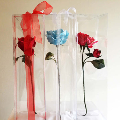 Beautiful long stemmed hand-crafted paper rose in clear box with a a lovely ribbon. A little something different! Give the gift that never dies. Size: 20cm