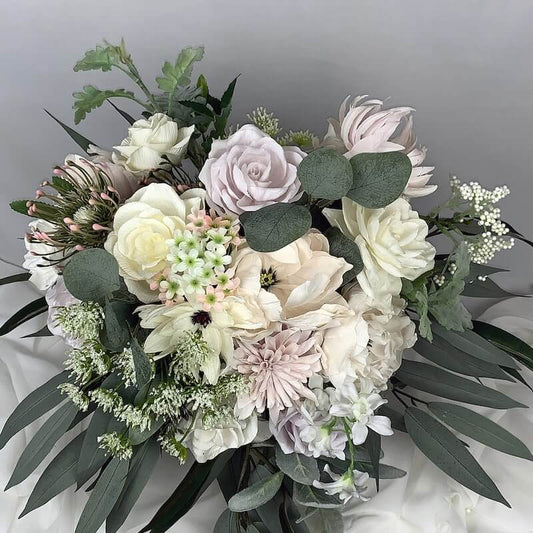 Shades of pink and cream roses, peonies and chrysanthemums with Queen Anne's lace, lambs ear and spider chrysanthemums.  Size: 40cm